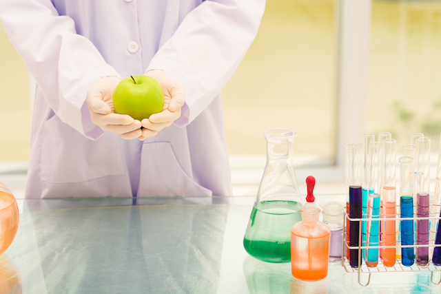 scientist with green apple