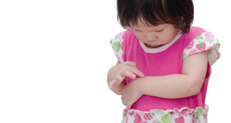 Little Asian girl scratching mosquito bite sore