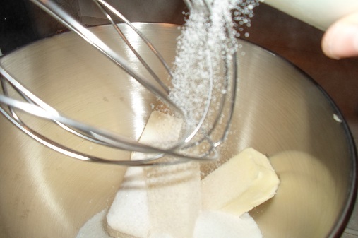 Pouring_Sugar_into_Butter_and_Shortening
